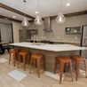 Clubhouse kitchen with large island and bar stools