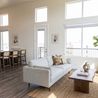 Staged living room with tall windows